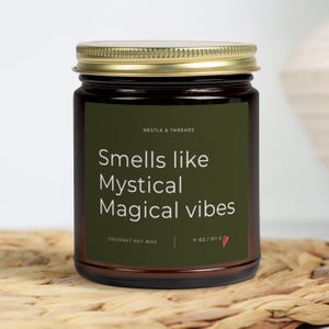 Smells Like Mystical Magical Vibes– Funny Celebrity Candle Gift for Her | Benson Boone Merch Candles | Music Lover Fan Gifts | Amber & Clear