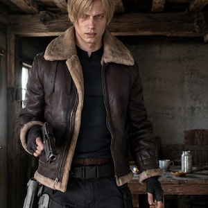 May include: A dark brown leather bomber jacket with a tan faux fur collar and lining, worn over a black long-sleeve shirt. The jacket features a front zipper closure, two vertical chest straps, and long sleeves with matching faux fur cuffs.