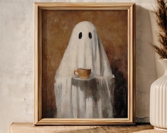 May include: A framed print depicts a ghost figure draped in a white sheet, holding a cup of coffee. The artwork has a vintage aesthetic with a brown background and a wooden frame. The ghost has two black eye holes.