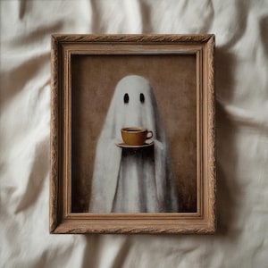 May include: A framed print featuring a whimsical ghost holding a cup of coffee. The ghost is draped in a white sheet with two black eye holes. The coffee cup and saucer are a warm yellow color, set against a sepia-toned background.