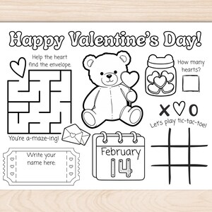 May include: Black and white Valentine's Day activity sheet with a maze, teddy bear holding a heart, tic-tac-toe, and a calendar showing February 14. Includes the text "Happy Valentine's Day!" and prompts to write a name and count hearts.