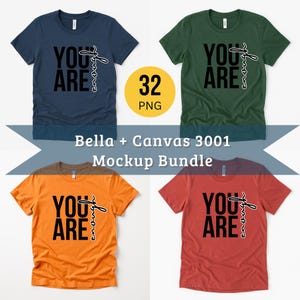 May include: Four t-shirts in navy blue, green, orange, and red, each with the words "YOU ARE" in black block letters and "enough" in a cursive font. A yellow circle with "32 PNG" is also present.
