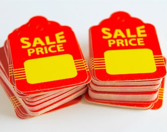 Puede incluir: Una pila de etiquetas de precio de venta rojas y amarillas con un espacio en blanco para escribir el precio.