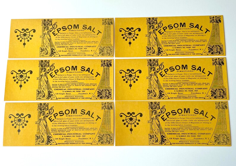 May include: Six vintage yellow paper labels with black text and illustrations. Each label reads "Epsom Salt" with directions for use and the company name "Chemical Industrial Company".
