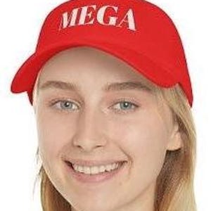 May include: A bright red baseball cap with the word "MEGA" printed in white across the front. The cap has a curved brim and a classic six-panel design. The hat is made of a durable fabric.