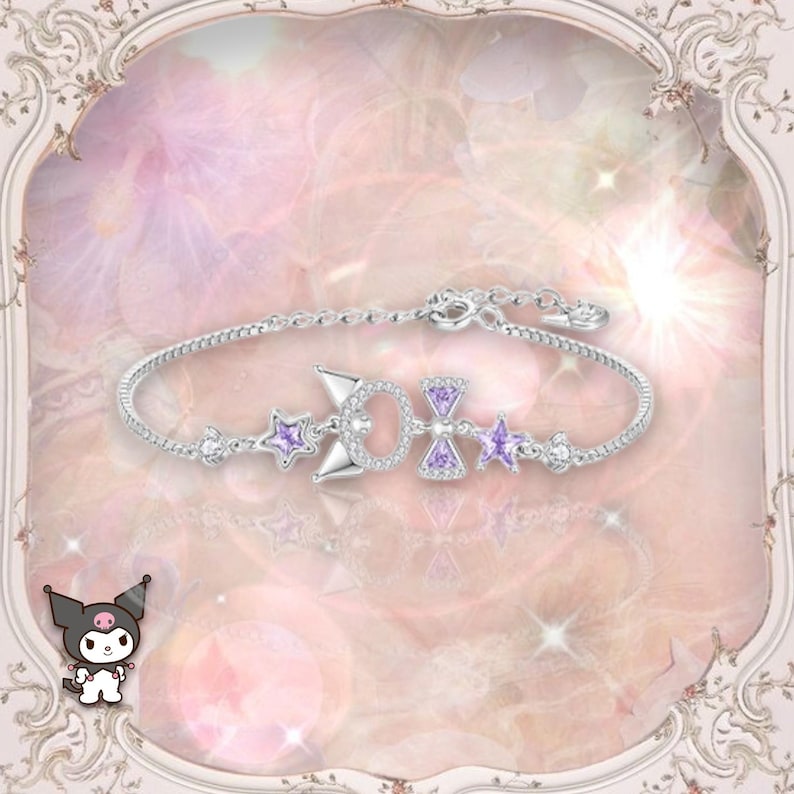 May include: A silver bracelet with a purple bow charm and star charms. The bracelet is on a pink and white background.