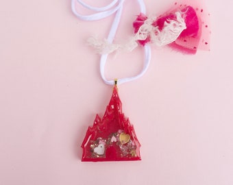 Princess castle resin shaker necklace.
