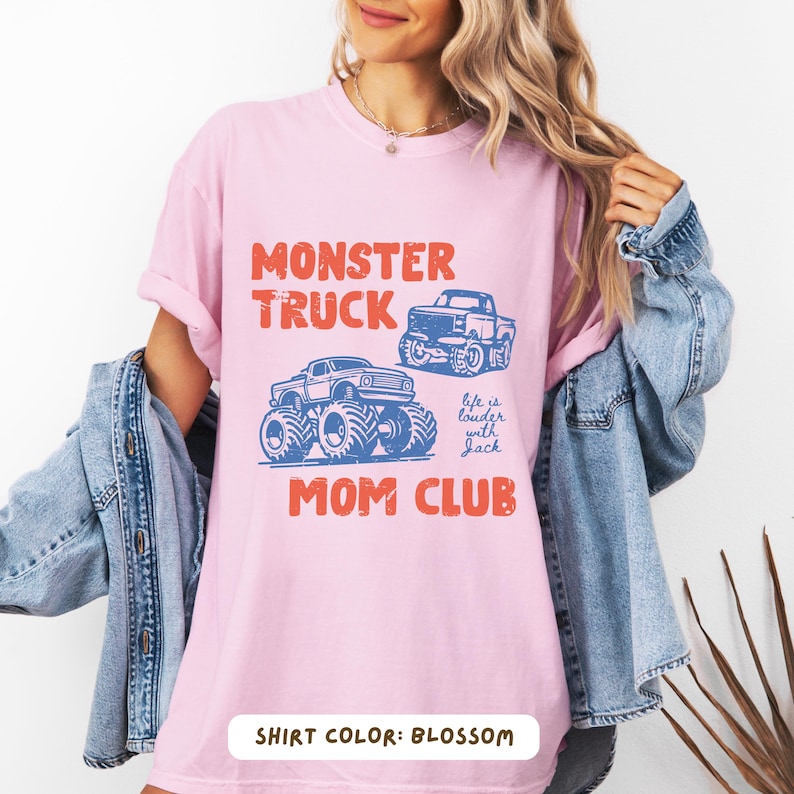 Monster truck themed mom t-shirt featuring bold red text and blue vintage trucks graphic, designed for mothers of boys with a racing-inspired aesthetic