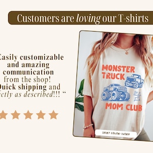 May include: Ivory-colored t-shirt with a Monster Truck Mom Club graphic in red and blue. The shirt features the text "Monster Truck" above two truck illustrations and "Mom Club" below. The shirt color is ivory.