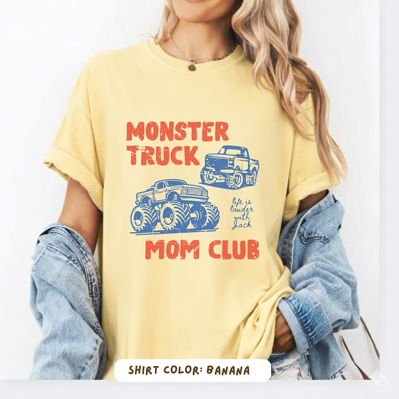 Monster truck themed mom t-shirt featuring bold red text and blue vintage trucks graphic, designed for mothers of boys with a racing-inspired aesthetic