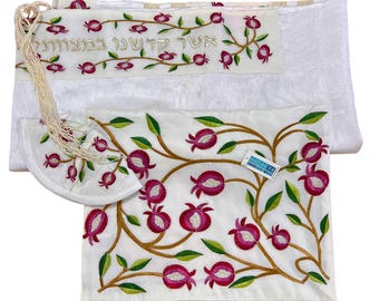 May include: White embroidered prayer shawl and kippah set. The shawl and kippah feature a floral design with red and green accents. The shawl has Hebrew text embroidered on it. The set is made of a soft, textured fabric.