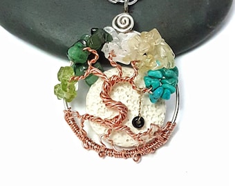 May include: A copper wire tree of life pendant necklace with a white coral center and various gemstones including turquoise, green aventurine, and clear quartz.