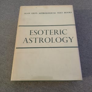 May include: A hardcover book titled "Esoteric Astrology" by Alan Leo. The book has a cream-colored cover with the title in large, dark green letters. The text "Alan Leo's Astrological Text Books" is printed at the top.