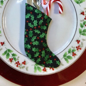 Christmas Table Socks hold Silverware in a Small Holly with Red Berries on Black Background - Set of Four