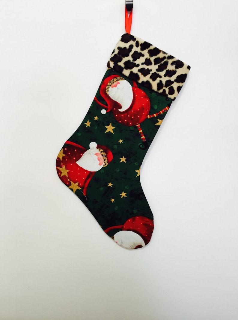 Whimsical Santa wearing Faux fur hats on Green Background with Faux Cheetah fur Cuff