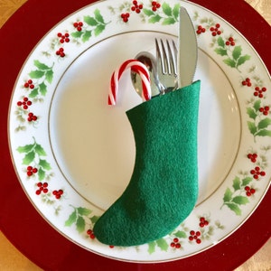 Christmas Sock Silverware Holder in a Holly Print with a Red Ribbon on Cream background image 4