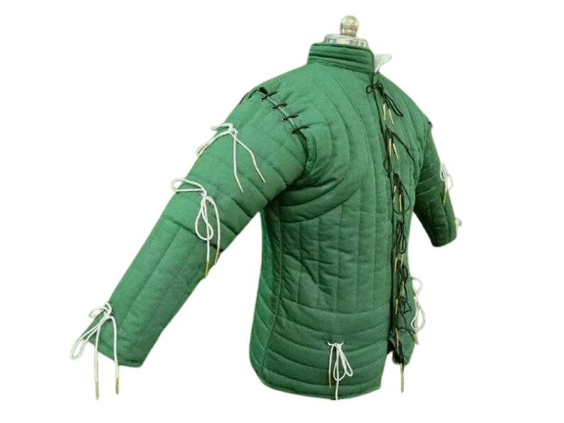 May include: Green padded gambeson with a high collar and long sleeves. The quilted jacket features vertical stitching and is laced with white and black cords. The sleeves are tied with white cords. This medieval garment is designed for historical reenactment or costume.