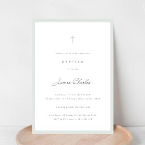 May include: A baptism invitation with a pale green border. The invitation features a cross at the top, followed by the word "BAPTISM" and the name "James Charles." Additional text includes the date, time, location, and RSVP information.