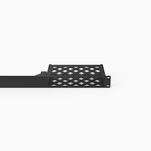 May include: A black metal rack mount shelf featuring a flat solid front panel section and a rectangular storage area with a decorative lattice or diamond-shaped cutout pattern. The unit includes side mounting flanges with pre-drilled holes.