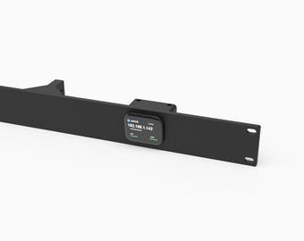 May include: A black 1U rack mount for a 19-inch server rack, designed to hold a JetKVM device. The mount features a central cutout where a JetKVM unit is installed, displaying the IP address 192.168.1.142 on its small digital screen.