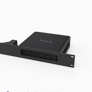 May include: A black 3D printed rack mount for a WiiM Pro or Pro Plus audio streamer. The mount features a 19-inch wide faceplate with a 1U height, designed to hold the square black device securely. The front panel displays orange touch controls.