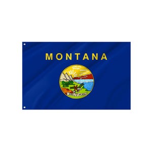 May include: A blue flag with the word MONTANA in gold lettering. The flag displays a circular emblem with a landscape scene, including mountains, a river, and a setting sun.