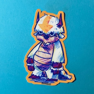 May include: A sticker of a cartoon white and orange creature with a red and blue striped body. The creature has a large head with a white and orange head covering. The sticker is on a light blue background.