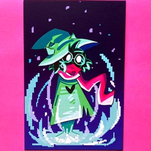 May include: A rectangular art print featuring a pixelated character with dark fur, round glasses, and a green pointed hat. The figure wears a green robe with a black heart emblem and a long pink scarf, surrounded by a glowing blue pixelated aura.