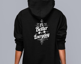 May include: Black hooded sweatshirt featuring the white text "1% Better Everyday" with a barbell graphic. The design is printed on the back of the hoodie. The sweatshirt has a drawstring hood and long sleeves, suitable for casual wear.