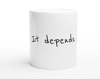 May include: White ceramic mug with the text "It depends." written in black.