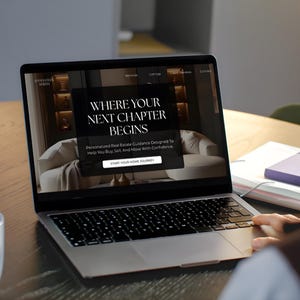 May include: A silver laptop displaying a website with the text WHERE YOUR NEXT CHAPTER BEGINS and Personalised Real Estate Guidance Designed To Help You Buy, Sell, And Move With Confidence, featuring a button labelled START YOUR HOME JOURNEY.