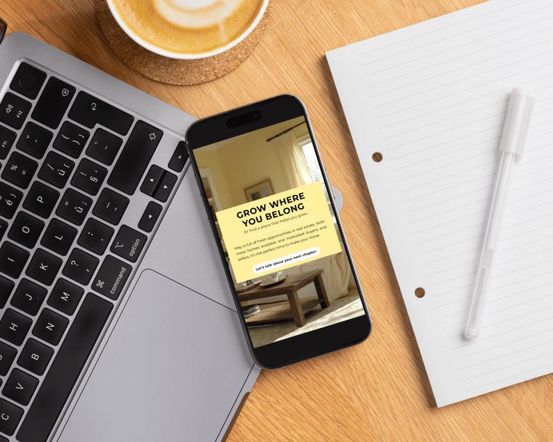 May include: A smartphone displays the text "GROW WHERE YOU BELONG" on a yellow background. A laptop, a cup of coffee, a pen, and a notepad are on a wooden desk. The laptop keyboard is visible.
