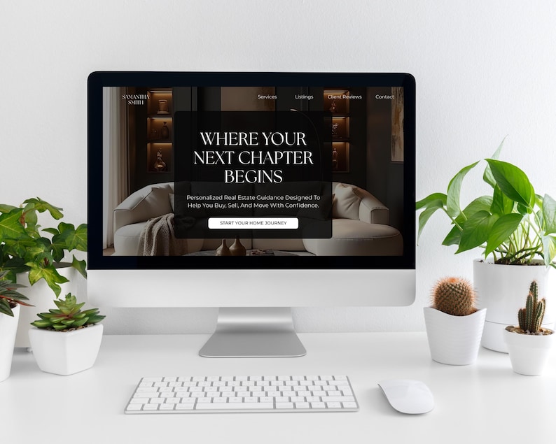 May include: A computer monitor displaying a real estate website with the text WHERE YOUR NEXT CHAPTER BEGINS and START YOUR HOME JOURNEY. The screen shows a living room interior, and the monitor is surrounded by several small potted plants.