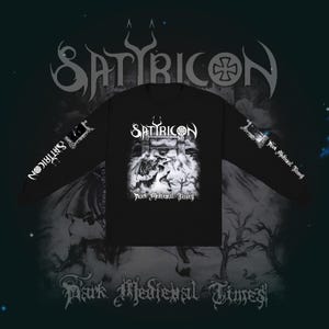 May include: Black long-sleeve shirt featuring the band name "Satyricon" in white gothic lettering. The shirt has a graphic of a medieval scene with the text "Dark Medieval Times". The band's name is also printed on the sleeves.