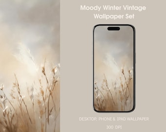 Op de afbeelding: Een digitale wallpaper set met een vintage esthetiek. De afbeelding toont een smartphone met een landschap van hoog gras tegen een bewolkte lucht. De tekst luidt "Moody Winter Vintage Wallpaper Set".