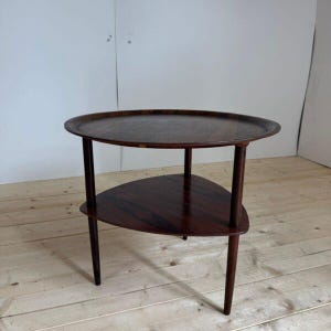 Rosewood coffee table with two shelves – Denmark (1960s)
