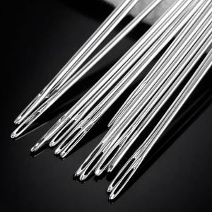 May include: A collection of long, silver sewing needles with large eyes, arranged on a dark, reflective surface. The needles are made of shiny metal and are slightly overlapping. The image highlights the needles' polished finish.