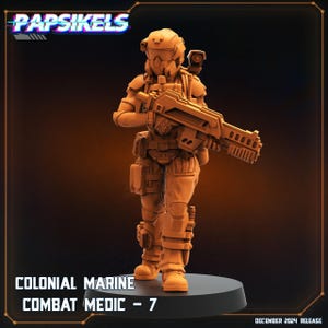 May include: A detailed miniature figure of a Colonial Marine Combat Medic, holding a futuristic rifle. The figure is painted in a muted orange color and has a helmet with a visor. The figure is standing on a round base. The text "COLONIAL MARINE COMBAT MEDIC - 7" is printed below the figure.