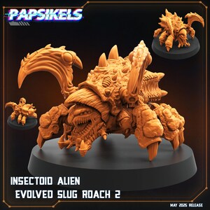 May include: An orange insectoid alien figure with multiple legs, claws, and a segmented body. The figure is labeled "INSECTOID ALIEN EVOLVED SLUG ROACH 2" and the logo "Papsikels" is visible. The release date is May 2025.