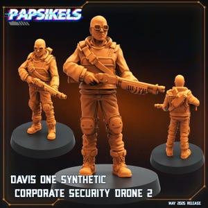 May include: Three orange-colored figurines of a person in tactical gear, holding a shotgun. The figures stand on black circular bases. The text "DAVIS ONE SYNTHETIC CORPORATE SECURITY DRONE 2" is at the bottom, with "Papsikels" at the top. "MAY 2025 RELEASE" is also visible.