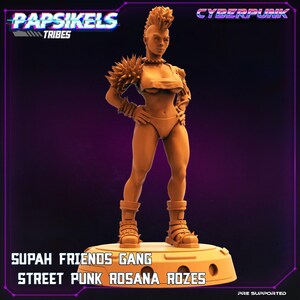 May include: A 3D printed miniature of a female character with a mohawk hairstyle, wearing a studded leather jacket and a bikini top. The miniature is posed with one hand on her hip and the other holding a weapon. The base of the miniature is labeled "Supah Friends Gang Street Punk Rosana Rozes".