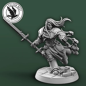 May include: A gray, detailed miniature figurine of a female warrior holding a sword and a staff. The figurine is posed in a dynamic action pose, with her hair flowing behind her. The figurine is standing on a circular base.