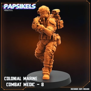 May include: A 3D printed miniature of a Colonial Marine Combat Medic, holding a pistol and wearing a helmet and armor. The miniature is painted in a light brown color and is standing on a black base. The text "COLONIAL MARINE COMBAT MEDIC - 8" is printed below the miniature.