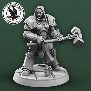May include: A gray miniature figurine of a female warrior wearing armor and holding a large hammer. The figurine is standing on a round base.