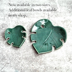 May include: Two green ceramic leaf-shaped bowls. The larger bowl is about 7 inches long and the smaller bowl is about 4 inches long.  Now available in two sizes. Additional leaf bowls available in my shop.