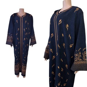 May include: A long, dark blue robe with a gold floral pattern. The robe has long sleeves and a V-neck.