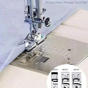 May include: A 3-piece rolled hem presser foot set for a sewing machine. The metal feet are shown in 3mm, 4mm, and 6mm sizes. One foot is attached to a sewing machine needle, stitching a light blue fabric edge on a metal plate with grid markings.