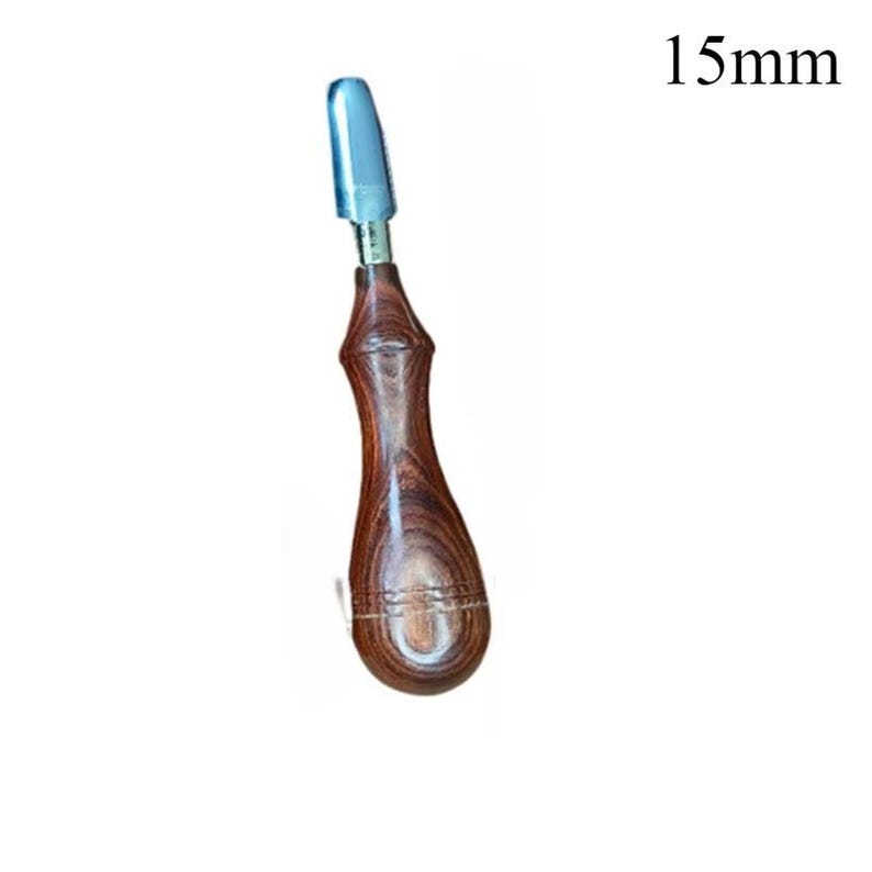 May include: A wood-handled tool with a silver-colored tip. The handle is a dark brown color with a curved, ergonomic design. The text "15mm" is visible in the upper right corner, indicating the tool's size.