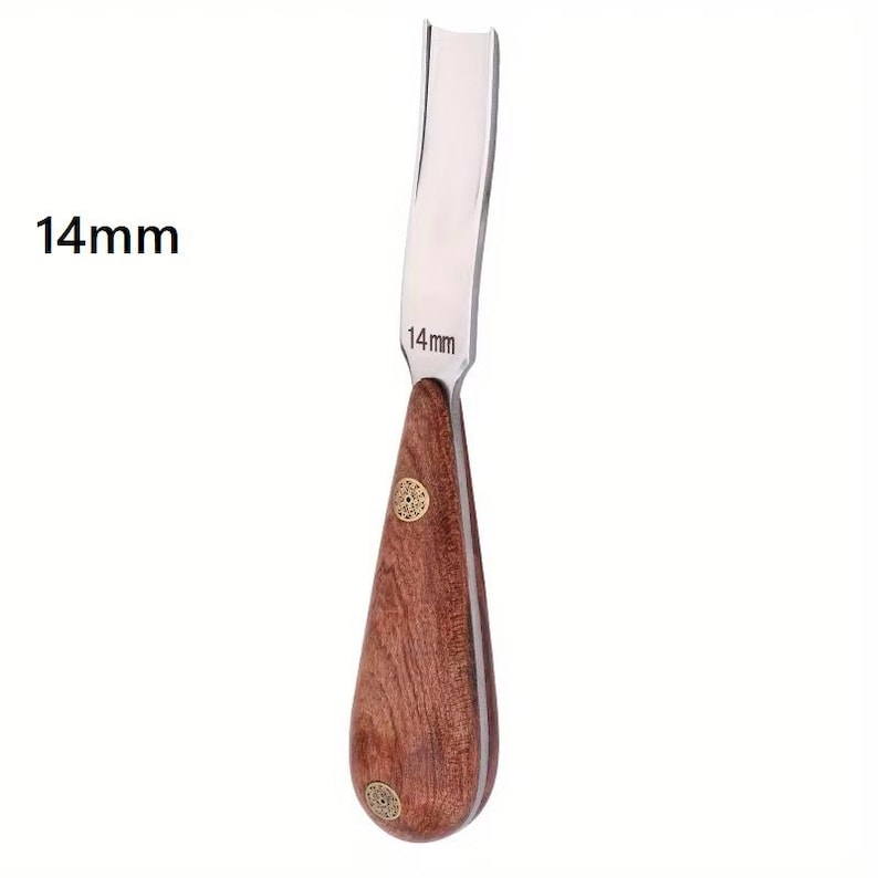May include: A wood carving gouge with a curved, polished steel blade. The handle is made of dark wood with brass accents. The text "14mm" is printed on the blade and near the handle. This tool is used for woodworking and carving.