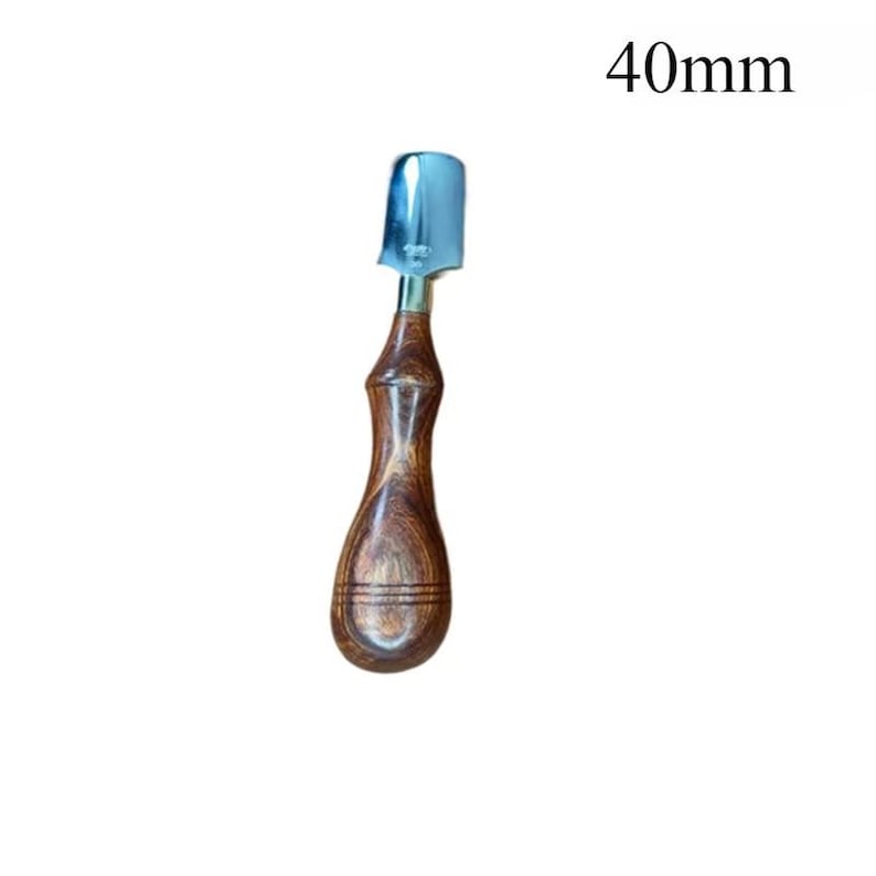 May include: A wood-handled leathercraft tool with a 40mm (1.57 inch) wide, curved, silver-colored blade. The handle is a dark brown, polished wood with a contoured shape for grip.